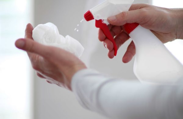 Disinfect Spray on Paper Towel to Clean Surfaces from Coronavirus