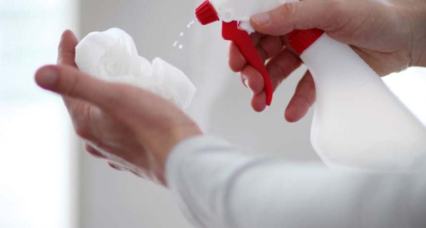 Disinfect Spray on Paper Towel to Clean Surfaces from Coronavirus